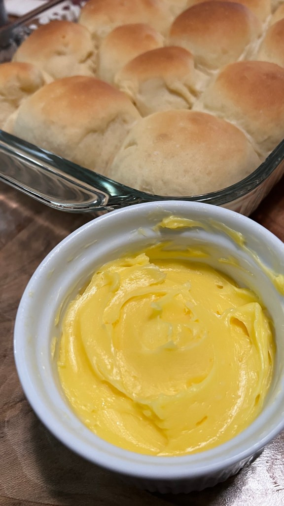An image of home made dinner rolls and fresh butter.