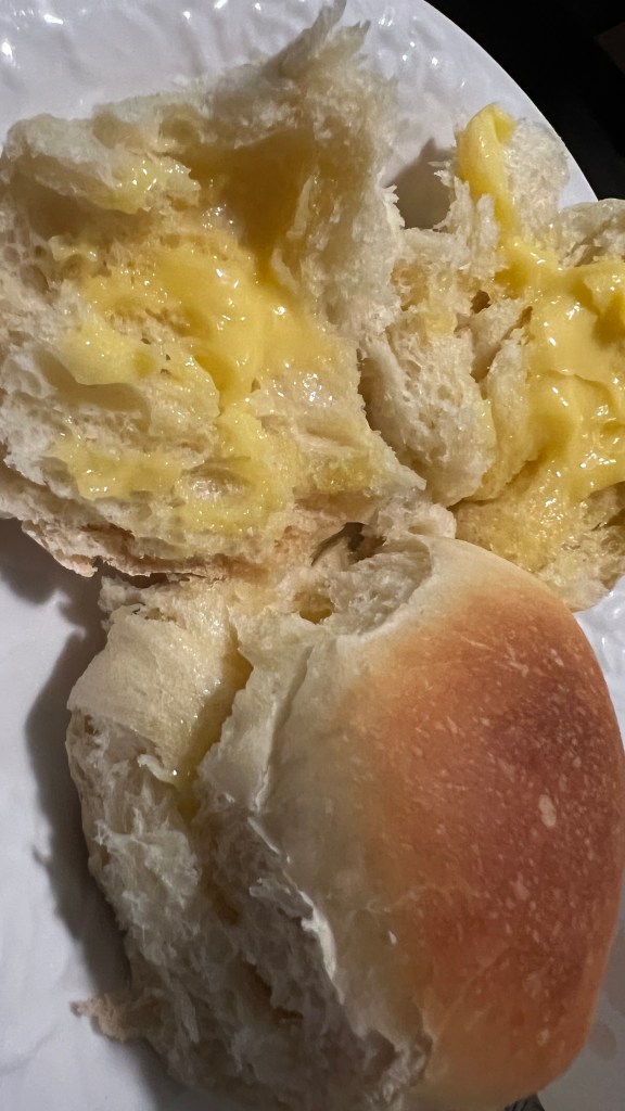 An image of home made dinner rolls and fresh butter.